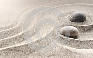 Zen garden meditation stone background with stones and lines in sand for relaxation balance and harmony spirituality or spa