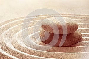 Zen garden meditation stone background with stones and lines in sand for relaxation balance and harmony spirituality or spa