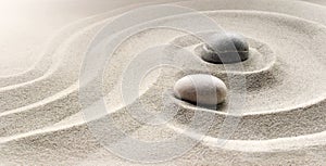 Zen garden meditation stone background with stones and lines in sand for relaxation balance and harmony spirituality or spa