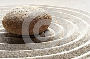 Zen garden meditation stone background with stones and lines in sand for relaxation balance and harmony spirituality or spa