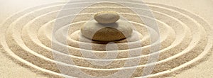 Zen garden meditation stone background with stones and lines in sand for relaxation balance and harmony spirituality or spa