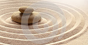 Zen garden meditation stone background with stones and lines in sand for relaxation balance and harmony spirituality or spa