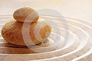 Zen garden meditation stone background with stones and lines in sand for relaxation balance and harmony spirituality or spa