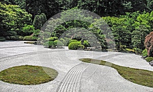Zen Garden in Portland, Oregonâ€™s Japanese Garden with raked gravel, pruned shrubbery, trees and perfect grooming