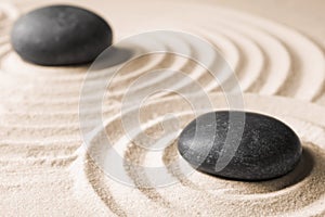 Zen garden stones on sand with pattern