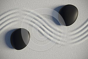 Zen garden in a top view with stones separated by a wave