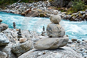Zen like stacked stones near river