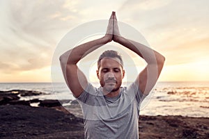Zen man, beach meditation and sunset for peace, wellness or healthy mindset by waves in summer. Yoga, prayer hands pose