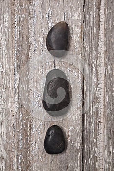 Zen Massage Stones on Rustic Wood