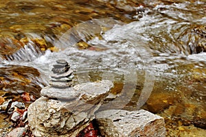 Zen meditation concept. Feng shui. Zen stones (cairn) and river water