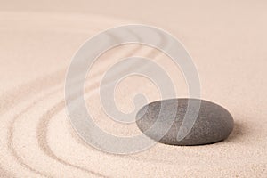 Zen meditation sand and stone pattern for relaxation and concentration photo