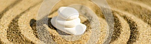 zen meditation stone in sand, concept for purity harmony and spirituality, spa wellness and yoga background