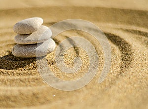 zen meditation stone in sand, concept for purity harmony and spirituality, spa wellness and yoga background