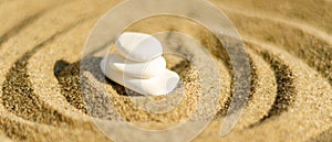 zen meditation stone in sand, concept for purity harmony and spirituality, spa wellness and yoga background