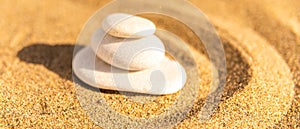 zen meditation stone in sand, concept for purity harmony and spirituality, spa wellness and yoga background