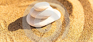 zen meditation stone in sand, concept for purity harmony and spirituality, spa wellness and yoga background