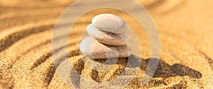 zen meditation stone in sand, concept for purity harmony and spirituality, spa wellness and yoga background