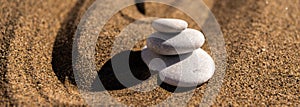 zen meditation stone in sand, concept for purity harmony and spirituality, spa wellness and yoga background