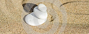 zen meditation stone in sand, concept for purity harmony and spirituality, spa wellness and yoga background