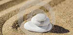 zen meditation stone in sand, concept for purity harmony and spirituality, spa wellness and yoga background