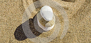 zen meditation stone in sand, concept for purity harmony and spirituality, spa wellness and yoga background