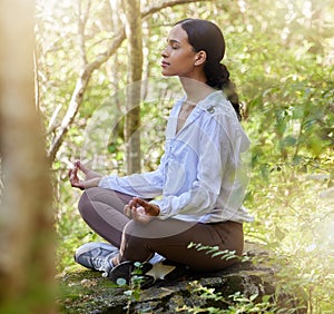 Zen, meditation and woman in nature or forest calm in peace, spiritual and doing yoga for awareness and faith. Mindful