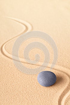 Zen meditation or yoga background with blue round stone for focus and concentration