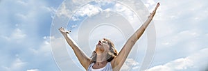 Zen middle aged woman raising arms up to breathe, banner
