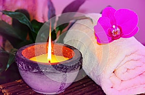 Zen orchid aromatic candle and towel spa concept