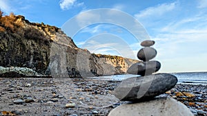 Zen pebbles on the beach dusk light