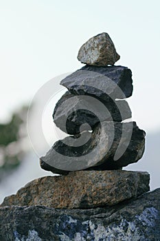 Zen pyramid of spa stones on the blurred background. Place for text. Mountain landscape. Calm place. Balance concept.