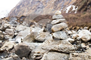 Zen rock arrangement that mimic the Stupa along hiking trail to the mountains of Annapurna, Nepal