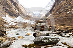 Zen rock arrangement that mimic the Stupa along hiking trail to the mountains of Annapurna, Nepal