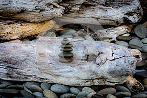 Zen rock stack on driftwood at Ruby Beach, Pacific Northwest