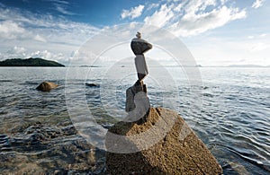 Zen rock tower on sea cost