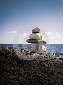 Zen rocks on a large glacial boulder at sea