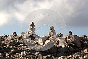 Zen rocks piles under cloudy sky