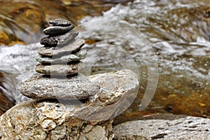 Zen meditation concept. Feng shui. Zen stones (cairn) and river water