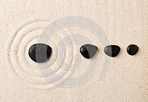 Zen sand and stone garden with raked circles. Simplicity, concentration or calmness abstract concept photo