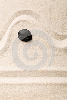 Zen sand and stone garden with raked lines and curves. Simplicity, concentration or calmness abstract concept