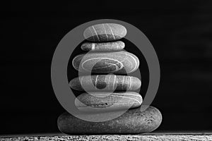 Zen sculpture. Harmony and balance, cairn, poise stones on wooden table