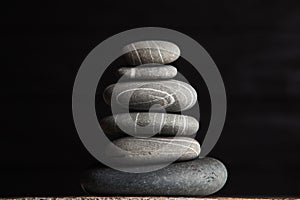 Zen sculpture. Harmony and balance, cairn, poise stones on wooden table