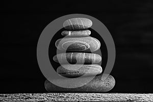 Zen sculpture. Harmony and balance, cairn, poise stones on wooden table