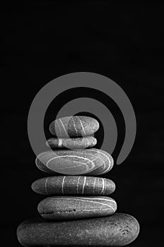 Zen sculpture. Harmony and balance, cairn, poise stones on wooden table