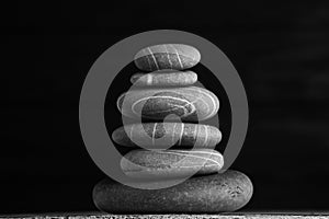 Zen sculpture. Harmony and balance, cairn, poise stones on wooden table