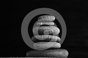 Zen sculpture. Harmony and balance, cairn, poise stones on wooden table