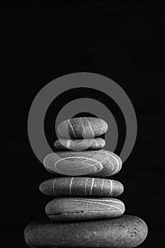 Zen sculpture. Harmony and balance, cairn, poise stones on wooden table