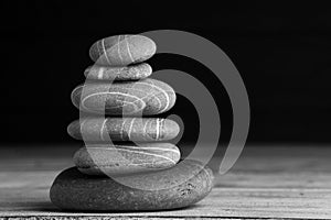 Zen sculpture. Harmony and balance, cairn, poise stones on wooden table