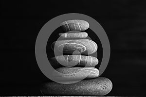 Zen sculpture. Harmony and balance, cairn, poise stones on wooden table