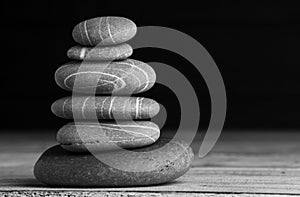 Zen sculpture. Harmony and balance, cairn, poise stones on wooden table